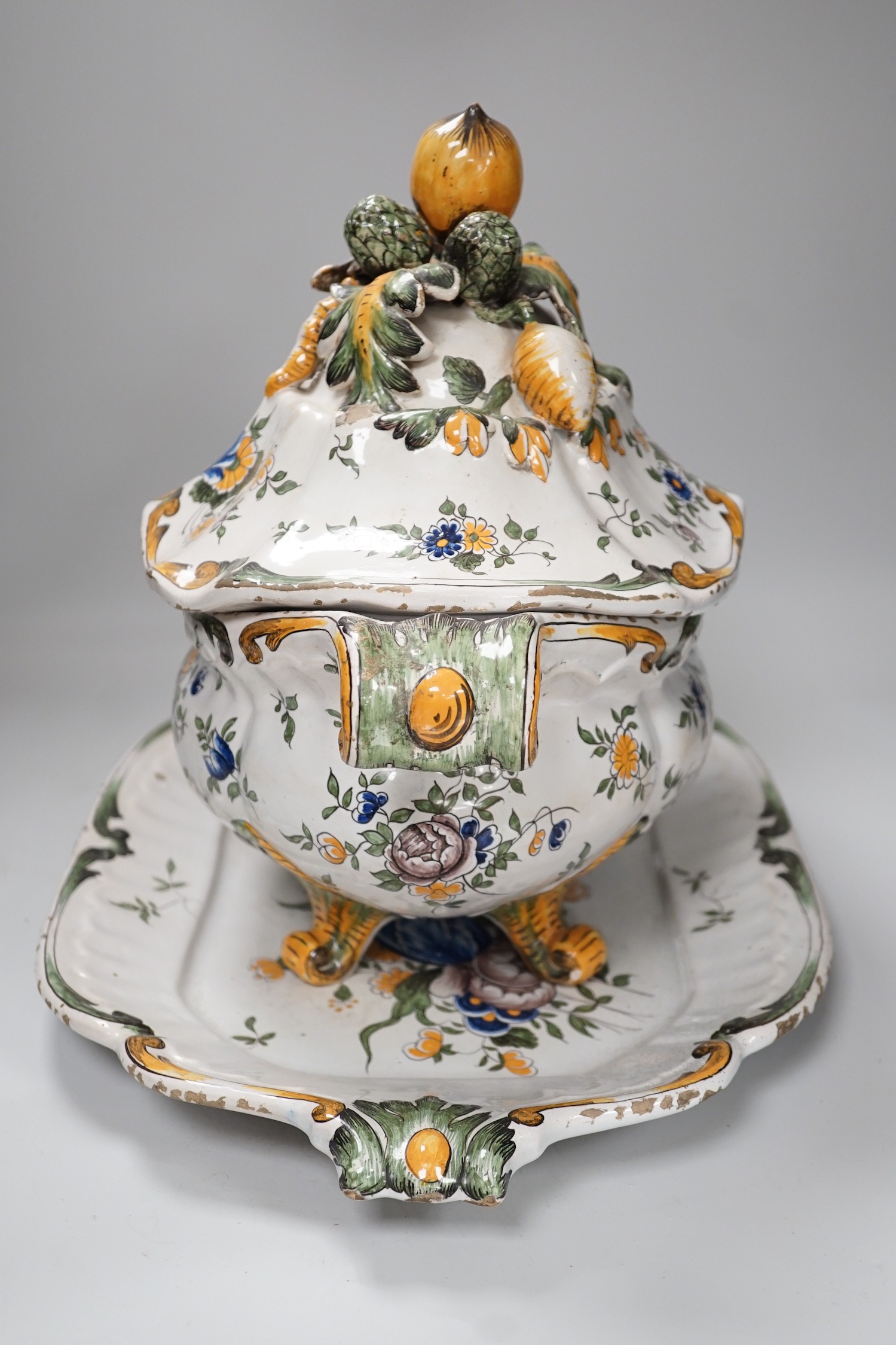 A 19th century French faience large tureen, cover and stand, 49cm wide